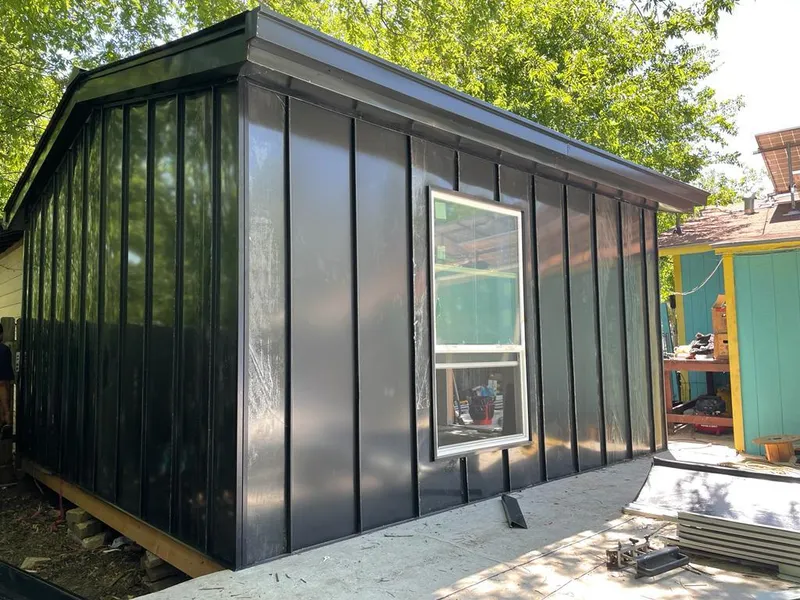 Black standing seam metal wall panels for Metal Roof Installation in Plaquemine