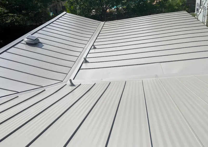 Solar attic fan installed on a metal roof for Roof Ventilation in Plaquemine